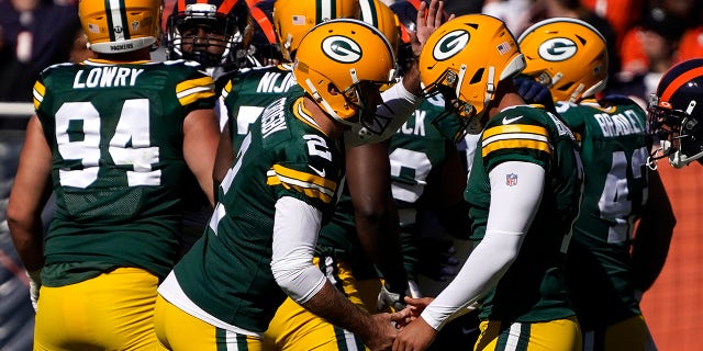 Green Bay Packers kicker Mason Crosby, left, celebrate his field goal with holder Corey Bojorquez during the first half of an NFL football game against the Chicago Bears Sunday, Oct. 17, 2021, in Chicago.