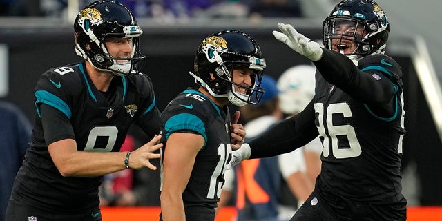 Jacksonville Jaguars kicker Matthew Wright (15), center, celebrates after kicking a field goal to win the game during the second half of an NFL football game between the Miami Dolphins and the Jacksonville Jaguars at the Tottenham Hotspur stadium in London, England, Sunday, Oct. 17, 2021.