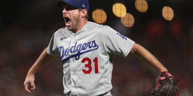 Los Angeles Dodgers pitcher Max Scherzer celebrates after the Dodgers defeated the San Francisco Giants in Game 5 of a baseball National League Division Series Thursday, Oct. 14, 2021, in San Francisco.