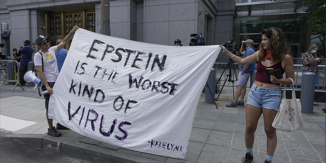 Protestors gather outside court as Ghislaine Maxwell is set to make her first court appearance on July 14, 2020 at the US District Court for the Southern District of New York, on a video link from her cell at the Metropolitan Detention Center in Brooklyn, over sex-trafficking charges tied to her former boyfriend Jeffrey Epstein in New York. - British socialite Ghislaine Maxwell pleaded not guilty in a New York court Tuesday to sex trafficking minors for her former partner, the financier Jeffrey Epstein. The 58-year-old denied six charges related to alleged crimes committed by Epstein, a well-connected sex offender who killed himself in prison while awaiting trial last summer. (Photo by TIMOTHY A. CLARY / AFP) (Photo by TIMOTHY A. CLARY/AFP via Getty Images)