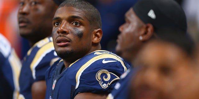 Michael Sam #96 of the St. Louis Rams watches from the bench during the second half of a pre-season against the New Orleans Saints game at the Edward Jones Dome on August 8, 2013 in St. Louis, Missouri. The Saints beat the Rams 26-24.