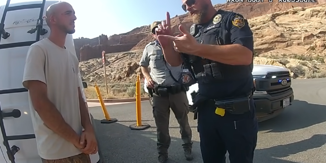 Moab Police Officer Eric Pratt, in bodycam footage released by investigators, is seen speaking to Brian Laundrie on Aug. 12. (Moab City Police Department)