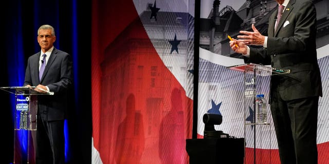 Democratic Gov. Phil Murphy of New Jersey, right, speaks during a gubernatorial debate with Republican challenger Jack Ciattarelli at Rowan University in Glassboro, New Jersey, on Tuesday, Oct. 12, 2021. (AP Photo/Frank Franklin II, Pool)