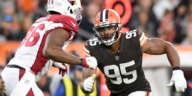 Myles Garrett of the Cleveland Browns rushes at Demetrius Harris of the Arizona Cardinals during the fourth quarter at FirstEnergy Stadium on Oct. 17, 2021, in Cleveland, Ohio.