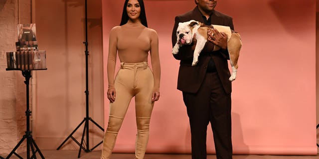 Kim Kardashian and Kenan Thompson are seen performing a "Skims" sketch during "Saturday Night Live" on October 9, 2021.
