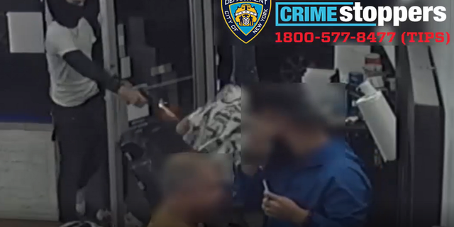 One of the suspects is seen opening fire at the victim. 