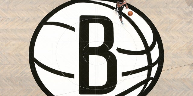 Kyrie Irving #11 of the Brooklyn Nets dribbles the ball during the game against the Milwaukee Bucks during Round 2, Game 1 of the 2021 NBA Playoffs on June 5, 2021 at Barclays Center in Brooklyn, New York.