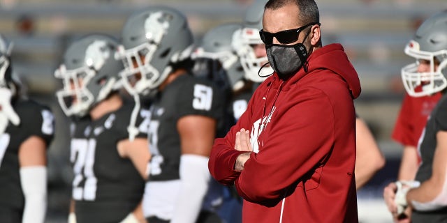 Oct 16, 2021; Pullman, Washington, USA; Washington State Cougars head coach Nick Rolovich looks on during warm up ups before a game against the Stanford Cardinal at Gesa Field at Martin Stadium.