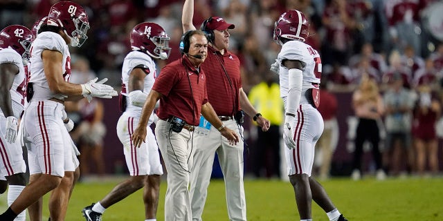 Alabama coach Nick Saban calls players during a time out in the first half of an NCAA college football game against Texas A&M on Saturday October 9, 2021 in College Station, Texas.