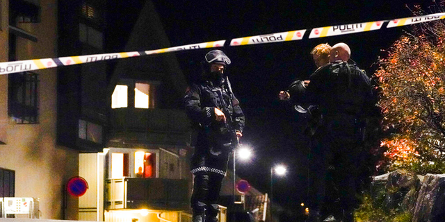 Police at the scene after an attack in Kongsberg, Norway, Wednesday, Oct. 13, 2021.