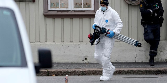 Police work near a site Thursday after a man killed some people in Kongsberg, Norway.