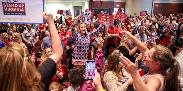 Amy Jahr sings "The Star Spangled Banner" after a Loudoun County School Board meeting was halted by the school board because the crowd refused to quiet down, in Ashburn, Virginia, June 22, 2021.