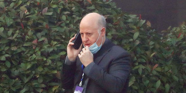 Peter Daszak, a member of the World Health Organization (WHO) team tasked with investigating the origins of the coronavirus disease (COVID-19), uses his mobile phone at a hotel in Wuhan, Hubei province, China February 3, 2021. REUTERS/Thomas Peter/File Photo