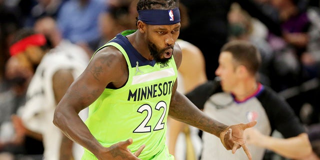 Minnesota Timberwolves guard Patrick Beverley (22) celebrates a basket against the New Orleans Pelicans in the first half of an NBA basketball game, Saturday, Oct. 23, 2021, in Minneapolis.