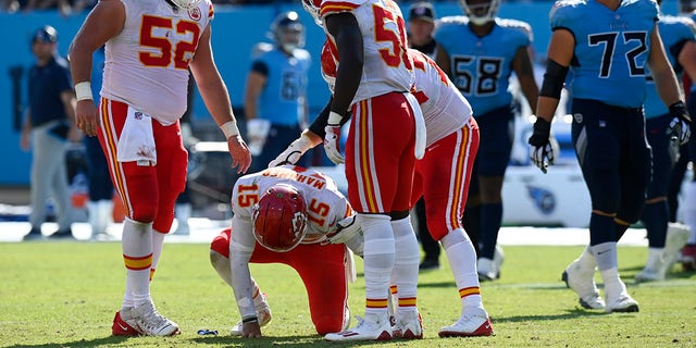 Kansas City Chiefs quarterback Patrick Mahomes (15) slowly gets up after being hit in the second half of a game against the Tennessee Titans Sunday, Oct. 24, 2021, in Nashville, Tenn.