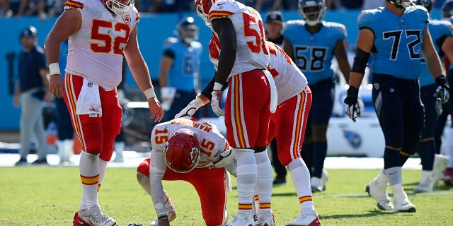 Kansas City Chiefs quarterback Patrick Mahomes (15) slowly gets up after being hit in the second half of a game against the Tennessee Titans Sunday, Oct. 24, 2021, in Nashville, Tenn.