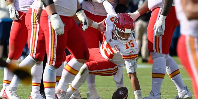 Kansas City Chiefs quarterback Patrick Mahomes (15) is helped up after being sacked by the Tennessee Titans in the second half Oct. 24, 2021 in Nashville, Tenn.