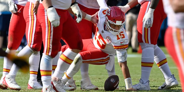 Kansas City Chiefs quarterback Patrick Mahomes (15) is helped up after being sacked by the Tennessee Titans in the second half Oct. 24, 2021 in Nashville, Tenn.