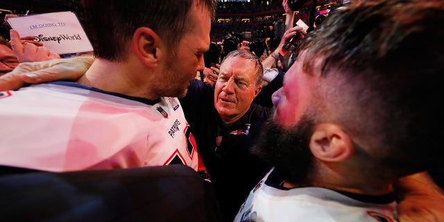 Head coach Bill Belichick of the New England Patriots celebrates with Tom Brady #12 and Julian Edelman #11 after the Patriots defeat the Los Angeles Rams 13-3 during Super Bowl LIII at Mercedes-Benz Stadium on February 3, 2019 in Atlanta, Georgia.