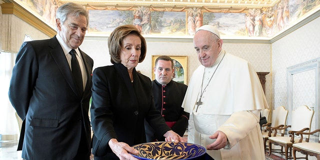US House Speaker Nancy Pelosi and her husband Paul Pelosi meet with Pope Francis in the Vatican on October 9, 2021.  