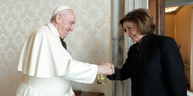 Pope Francis reacts during his meeting with the Speaker of the United States House of Representatives, Nancy Pelosi, at the Vatican on October 9, 2021.  