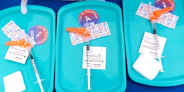 Pfizer COVID-19 vaccine doses are prepared for members of the community 12 years and up, Wednesday, May 19, 2021, at a clinic held by Community of Hope, outside the Washington School for Girls in southeast Washington.