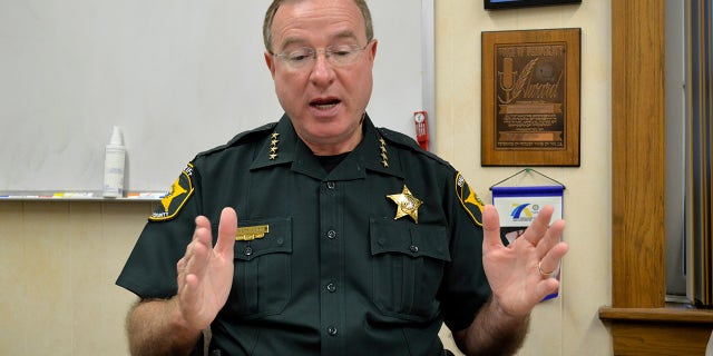 Polk County Sheriff Grady Judd was speaking at a church service on March 12 when a murder suspect was arrested.