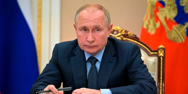 Russian President Vladimir Putin attends a meeting with the heads of the intelligence services of the Commonwealth of Independent States (CIS) countries via teleconference in Moscow, Russia, Wednesday, Oct. 13, 2021. (Alexei Druzhinin, Sputnik, Kremlin Pool Photo via AP)