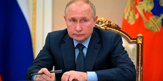 Russian President Vladimir Putin attends a meeting with the heads of the intelligence services of the Commonwealth of Independent States (CIS) countries via teleconference in Moscow, Russia, Wednesday, Oct. 13, 2021. (Alexei Druzhinin, Sputnik, Kremlin Pool Photo via AP)