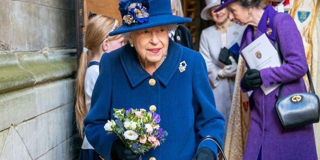 Britain's Queen Elizabeth II, followed by Britain's Princess Anne, right, arrives to attend a Service of Thanksgiving to mark the Centenary of the Royal British Legion at Westminster Abbey, in London, Tuesday, Oct. 12, 2021.