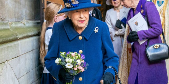 Britain's Queen Elizabeth II, followed by Britain's Princess Anne, right, arrives to attend a Service of Thanksgiving to mark the Centenary of the Royal British Legion at Westminster Abbey, in London, Tuesday, Oct. 12, 2021.