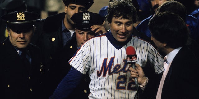 Ray Knight #22 of the New York Mets being interviewed by Marv Albert after the Mets win Game 7 of the 1986 World Series against the Boston Red Sox in Shea Stadium on Oct. 27, 1986 in Flushing, New York.