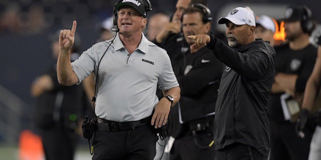 Oakland Raiders head coach Jon Gruden (left) and special teams coordinator Rich Bisaccia watch from the sidelines against the Green Bay Packers in the second half at Investors Group Field, Aug. 22, 2019, in Winnipeg, Manitoba, Canada. The Raiders defeated the Packers, 22-21.