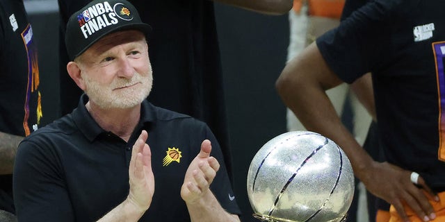 Phoenix Suns owner Robert Sarver stands with the Western Conference Championship trophy after the Suns beat the Los Angeles Clippers to win the series at Staples Center in Los Angeles on June 30, 2021.