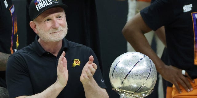 Phoenix Suns owner Robert Thurber stands with the Western Conference Championship trophy after the Suns defeated the Los Angeles Clippers to win the series on June 30, 2021 at the Staples Center in Los Angeles.