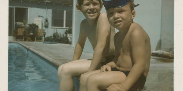 Brothers Ron and Clint Howard are poolside on Cordova Street. 