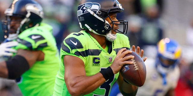 Seattle Seahawks quarterback Russell Wilson (3) passes against the Los Angeles Rams during the first half of an NFL football game, Thursday, Oct. 7, 2021, in Seattle.