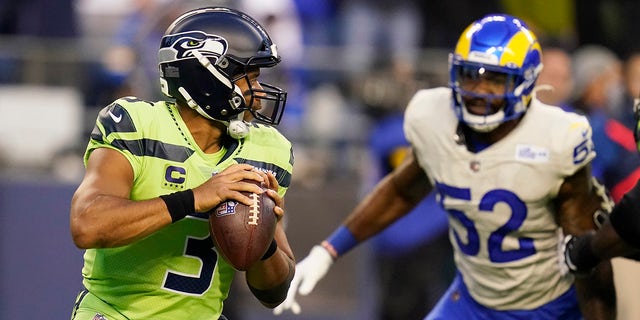 Seattle Seahawks quarterback Russell Wilson (3) passes against the Los Angeles Rams in the first half of an NFL football game on Thursday, October 7, 2021, in Seattle.