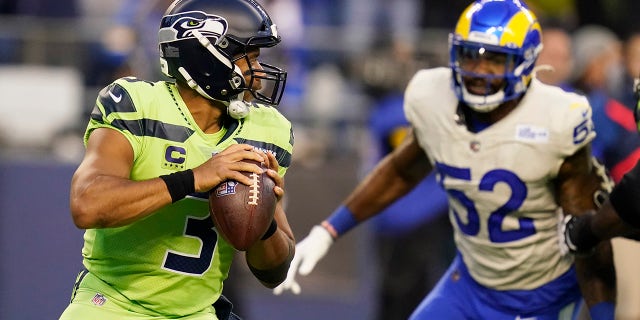 Seattle Seahawks quarterback Russell Wilson (3) passes against the Los Angeles Rams in the first half of an NFL football game on Thursday, October 7, 2021, in Seattle.