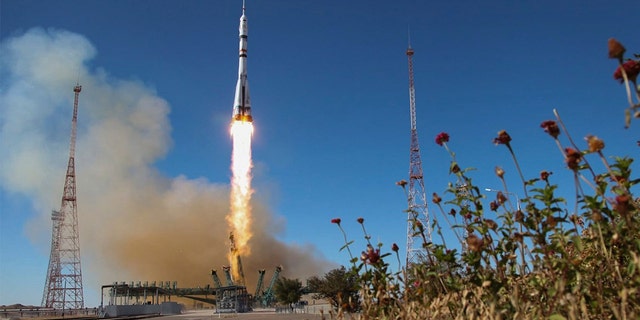 In this handout photo released by Roscosmos Space Agency, the Soyuz-2.1, a rocket booster with Soyuz MS-19 space ship carrying actress Yulia Peresild, film director Klim Shipenko and cosmonaut Anton Shkaplerov to the International Space Station, ISS, blasts off at the Russian leased Baikonur cosmodrome, Kazakhstan, Tuesday, Oct. 5, 2021. 