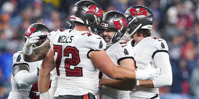 Tampa Bay Buccaneers kicker Ryan Succop, second from right, is congratulated after scoring a field goal late in the fourth quarter during an NFL football game on Sunday, Oct. 3, 2021, in Foxborough, Massachusetts . 