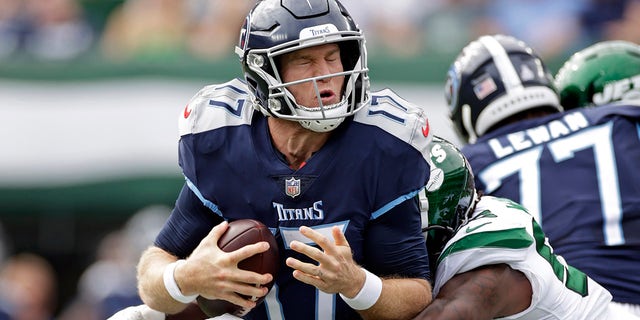 Tennessee Titans quarterback Ryan Tannehill (17) is sacked by New York Jets linebacker Quincy Williams (56) during an NFL football game on Sunday, October 3, 2021, in East Rutherford , New Jersey.