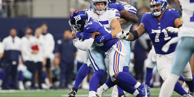 New York Giants running back Saquon Barkley (26) runs with the ball against the Dallas Cowboys.