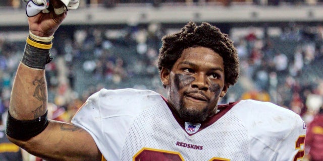 Washington Redskins safety Sean Taylor raises his hand to acknowledge fans after the Redskins defeated the Philadelphia Eagles in Philadelphia in this January 1, 2006 file photo. 