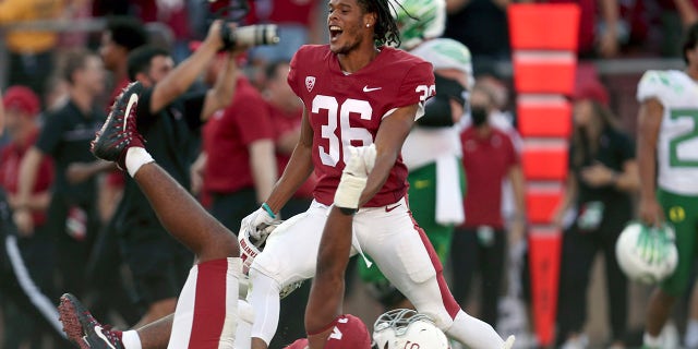 Stanfords' Jaden Slocum (36) and Jacob Mangum-Farrar (14) celebrate after defeating Oregon in an NCAA college football game in Stanford, Calif., Saturday, Oct. 2, 2021.