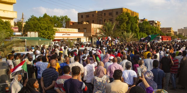 Demonstrators shout slogans as they gather to support current civilian government during a demonstration in Khartoum, Sudan on October 21, 2021. (Photo by Mahmoud Hjaj/Anadolu Agency via Getty Images)