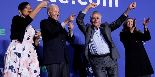 Democratic candidate for governor of Virginia Terry McAuliffe dances onstage next to his wife Dorothy, U.S. President Joe Biden, and Democratic Virginia Lt. Gov. candidate Hala Ayala at a rally in Arlington, Virginia, U.S. October 26, 2021. REUTERS/Jonathan Ernst