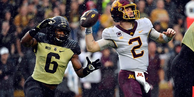 Purdue Boilermakers linebacker Jalen Graham attempts to sack Minnesota Golden Gophers quarterback Tanner Morgan during the second half at Ross-Ade Stadium Oct 2, 2021. Minnesota won 20-13.