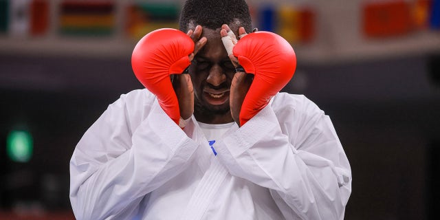 Tareg Hamedi of Team Saudi Arabia reacts after loosing to Sajad Ganjzadeh of Team Iran during the Men's Karate Kumite +75kg Gold Medal Bout on day fifteen of the Tokyo 2020 Olympic Games at Nippon Budokan on Aug. 7, 2021 在东京, 日本.