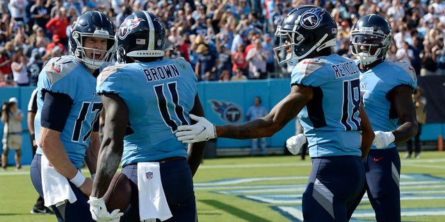 Tennessee Titans quarterback Ryan Tannehill (17) celebrates with wide receiver A.J. Brown (11) after they combined for a 24-yard touchdown pass against the Kansas City Chiefs in the first half Sunday, Oct. 24, 2021, in Nashville, Tenn.